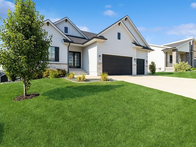 2013 Autumn Blaze Dr, Norwalk, IA 50211 - modern farmhouse featuring french doors, board and batten siding, a front lawn, concrete driveway, and an attached garage