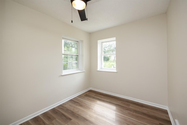 3912 53rd St, Des Moines, IA 50310 - empty room with wood finished floors and a ceiling fan
