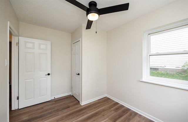 3912 53rd St, Des Moines, IA 50310 - unfurnished bedroom with wood finished floors, ceiling fan, and a closet