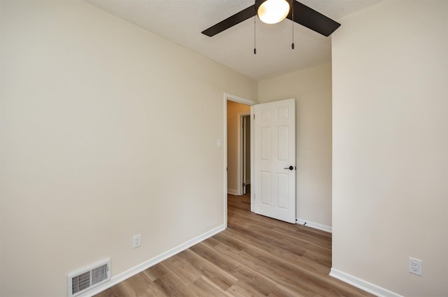 3912 53rd St, Des Moines, IA 50310 - empty room featuring a ceiling fan and light wood-style flooring