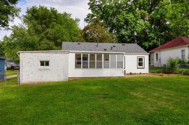 3912 53rd St, Des Moines, IA 50310 - back of property featuring a sunroom and a shingled roof