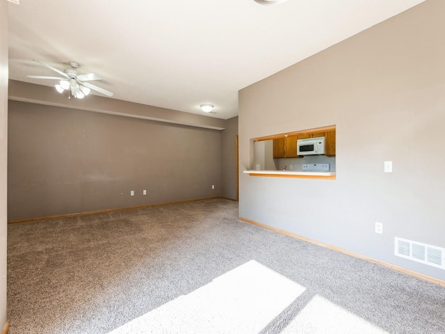 1106 N 6th St Unit 42, Indianola, IA 50125 - carpeted empty room with ceiling fan and baseboards