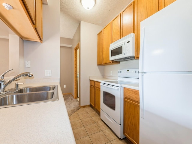 1106 N 6th St Unit 42, Indianola, IA 50125 - kitchen with white appliances, light countertops, light tile patterned floors, and a textured ceiling