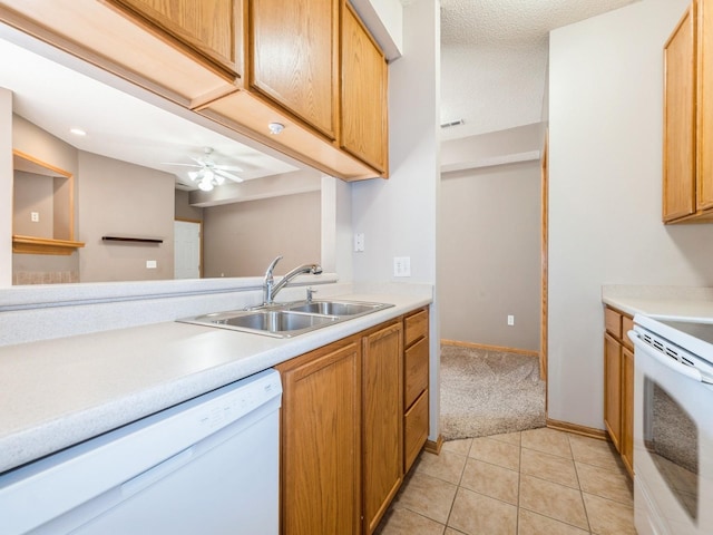 1106 N 6th St Unit 42, Indianola, IA 50125 - kitchen with white appliances, light countertops, ceiling fan, and light tile patterned floors