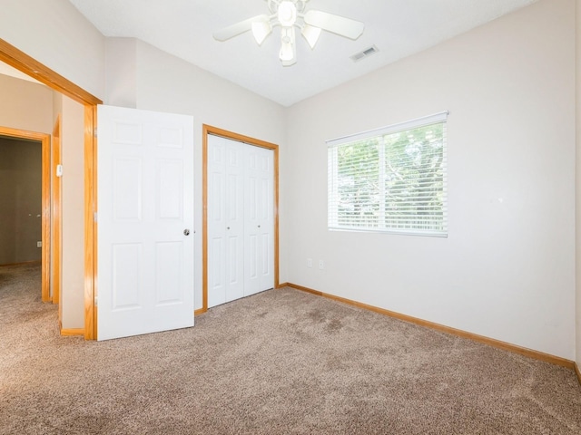 1106 N 6th St Unit 42, Indianola, IA 50125 - unfurnished bedroom featuring carpet flooring, a closet, and a ceiling fan