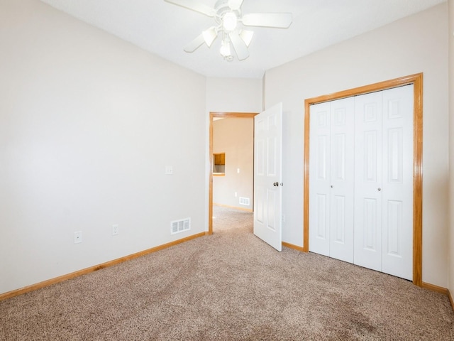 1106 N 6th St Unit 42, Indianola, IA 50125 - unfurnished bedroom featuring carpet, a closet, and a ceiling fan