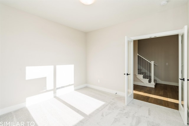 3601 NW 27th St, Ankeny, IA 50023 - spare room featuring stairway, carpet flooring, and a smoke detector