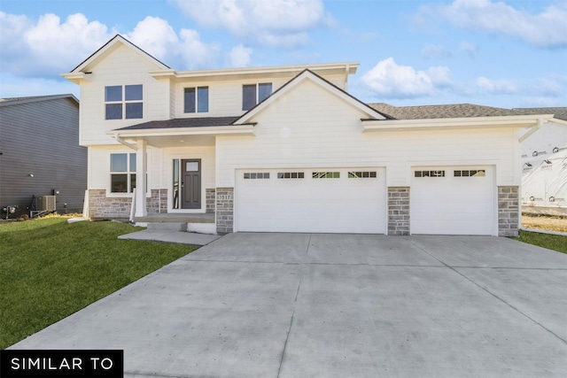 3601 NW 27th St, Ankeny, IA 50023 - view of front of house with stone siding, driveway, a front lawn, and an attached garage