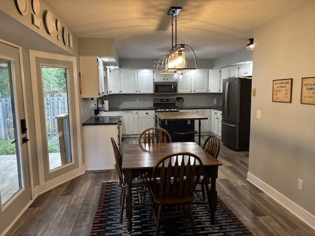 8200 Goodman Dr, Urbandale, IA 50322 - dining space with dark wood-style floors
