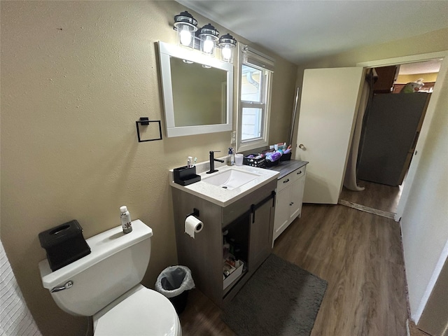 607 E Jasper St, Pleasantville, IA 50225 - bathroom featuring vanity and wood finished floors