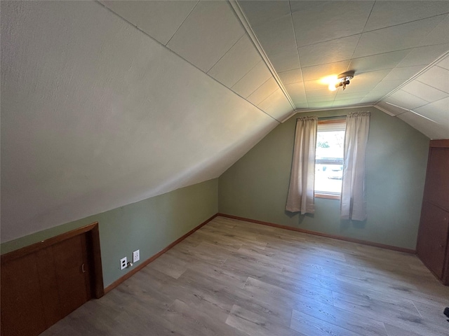 607 E Jasper St, Pleasantville, IA 50225 - bonus room featuring lofted ceiling and wood finished floors