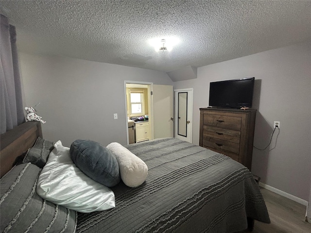 607 E Jasper St, Pleasantville, IA 50225 - bedroom featuring wood finished floors and a textured ceiling