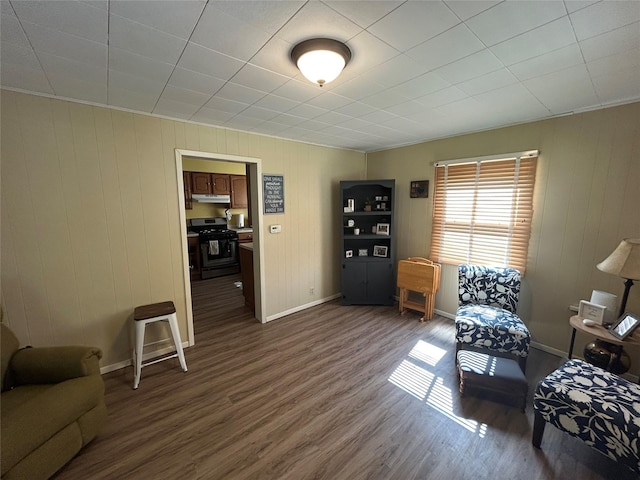 607 E Jasper St, Pleasantville, IA 50225 - living room with dark wood-type flooring and wood walls