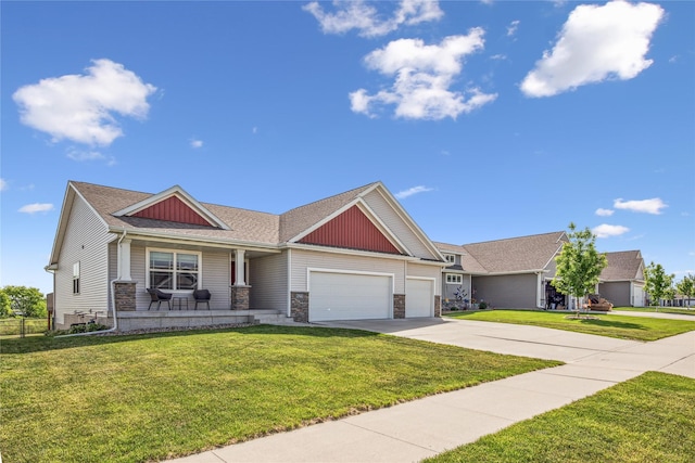 629 Mallard Pointe Dr NW, Bondurant, IA 50035 - craftsman house featuring an attached garage, concrete driveway, a porch, and a front yard