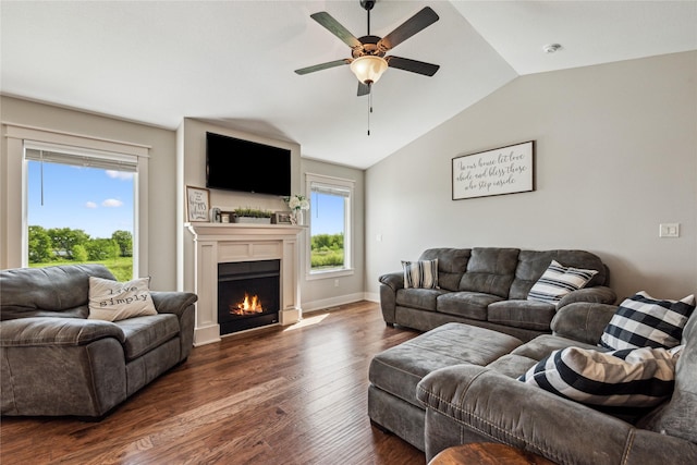 629 Mallard Pointe Dr NW, Bondurant, IA 50035 - living room featuring vaulted ceiling, a ceiling fan, wood finished floors, and a lit fireplace