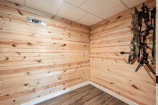 629 Mallard Pointe Dr NW, Bondurant, IA 50035 - spare room with a drop ceiling, a sauna, dark wood finished floors, and wooden walls
