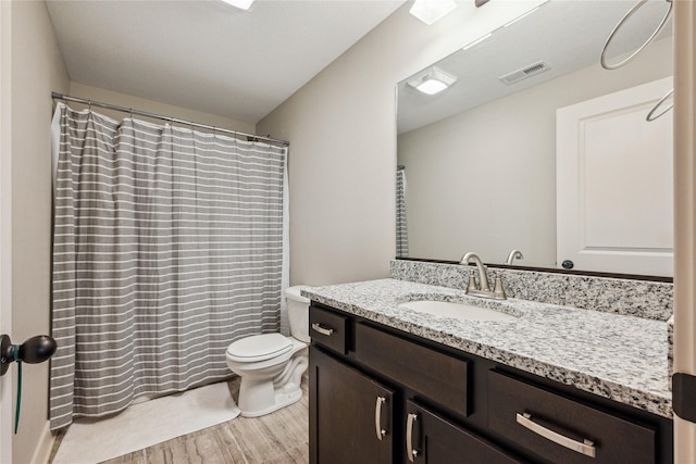 629 Mallard Pointe Dr NW, Bondurant, IA 50035 - full bath featuring wood finished floors, vanity, and a shower with shower curtain