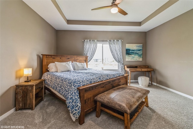 9416 Rushbrook Dr, Johnston, IA 50131 - carpeted bedroom featuring a raised ceiling and a ceiling fan