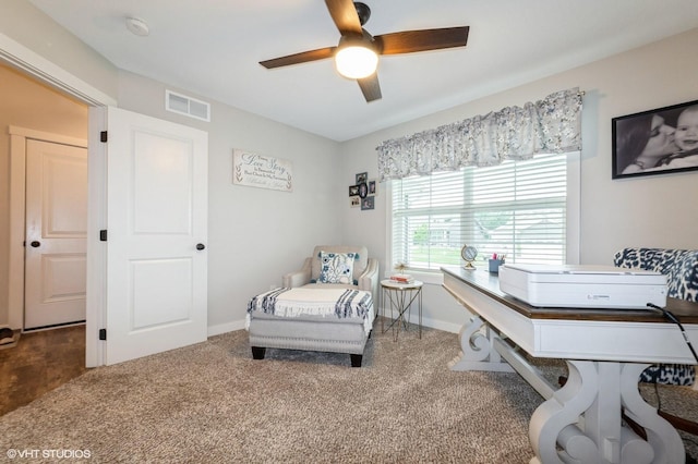 2401 E 50th St, Des Moines, IA 50317 - carpeted home office with a ceiling fan and baseboards