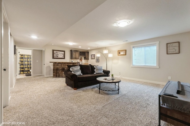 2401 E 50th St, Des Moines, IA 50317 - living area featuring carpet flooring, healthy amount of natural light, recessed lighting, and bar