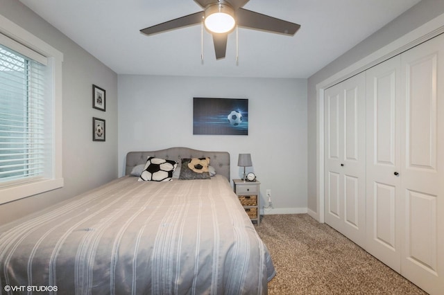 2401 E 50th St, Des Moines, IA 50317 - bedroom with carpet flooring, a closet, and ceiling fan