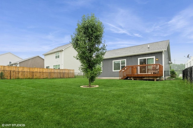 2401 E 50th St, Des Moines, IA 50317 - back of property with a fenced backyard and a deck