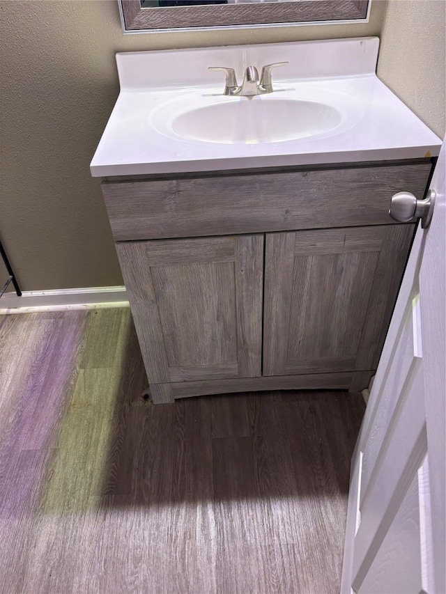 3112 52nd St, Des Moines, IA 50310 - bathroom featuring vanity and wood finished floors