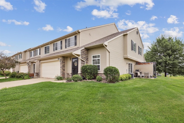 601 Orchard Hills Dr Unit 7006, Norwalk, IA 50211 - view of front facade with driveway, a front lawn, an attached garage, and stone siding