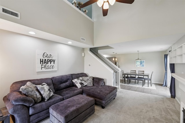 601 Orchard Hills Dr Unit 7006, Norwalk, IA 50211 - living area with stairway, light carpet, ceiling fan, light tile patterned flooring, and recessed lighting