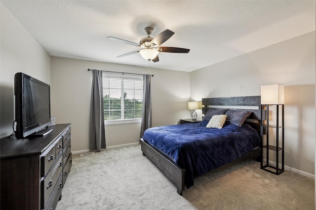 601 Orchard Hills Dr Unit 7006, Norwalk, IA 50211 - bedroom featuring light colored carpet, ceiling fan, and a textured ceiling