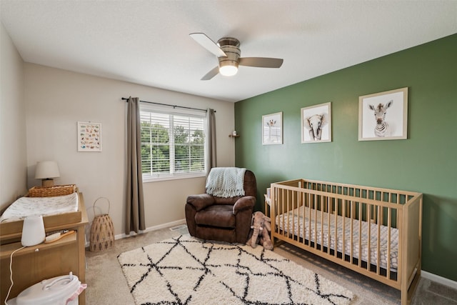 601 Orchard Hills Dr Unit 7006, Norwalk, IA 50211 - carpeted bedroom with a nursery area and a ceiling fan
