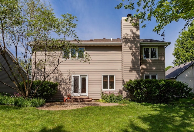 3806 Columbine Ave, Ames, IA 50010 - back of house with a chimney and a yard