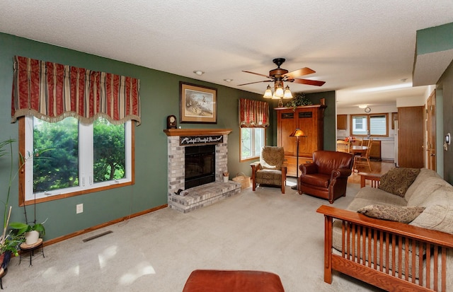 3806 Columbine Ave, Ames, IA 50010 - carpeted living room featuring a brick fireplace, ceiling fan, and a textured ceiling