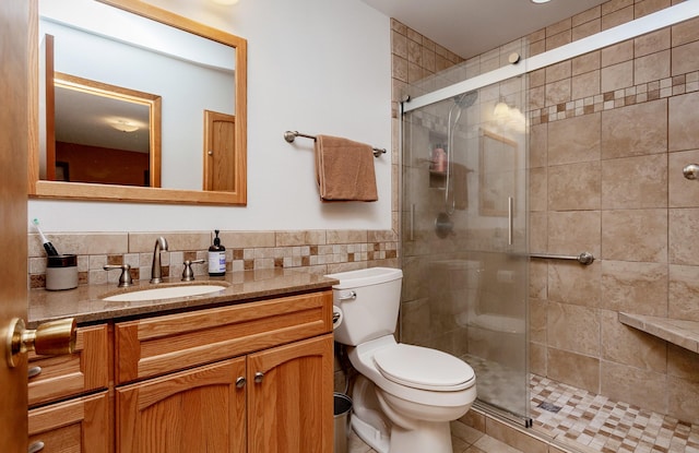 3806 Columbine Ave, Ames, IA 50010 - bathroom featuring tile walls, vanity, a stall shower, wainscoting, and tile patterned floors