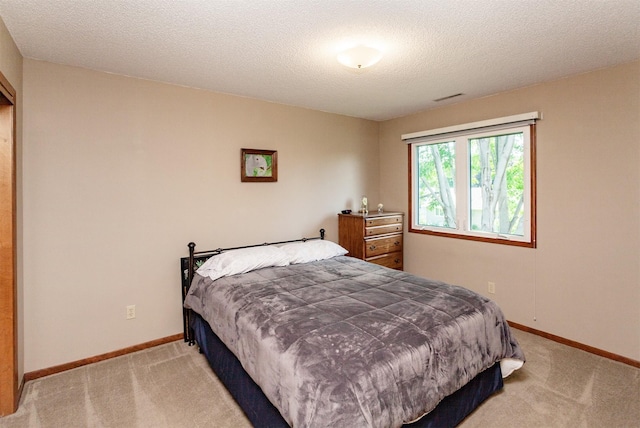 3806 Columbine Ave, Ames, IA 50010 - carpeted bedroom featuring baseboards and a textured ceiling