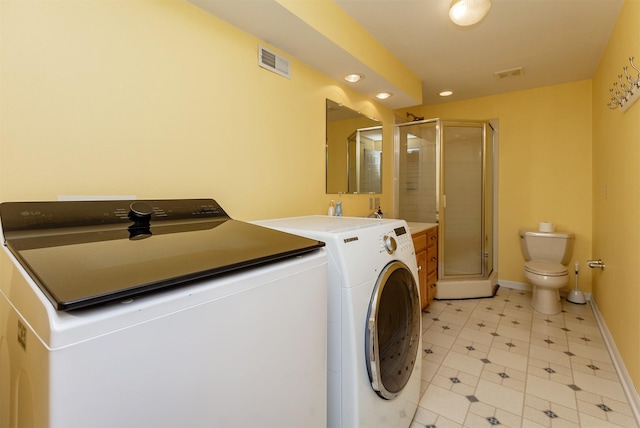 3806 Columbine Ave, Ames, IA 50010 - laundry room featuring separate washer and dryer, recessed lighting, and light tile patterned flooring