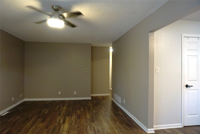 609 E Filmore St, Winterset, IA 50273 - empty room with ceiling fan, wood finished floors, and a textured ceiling