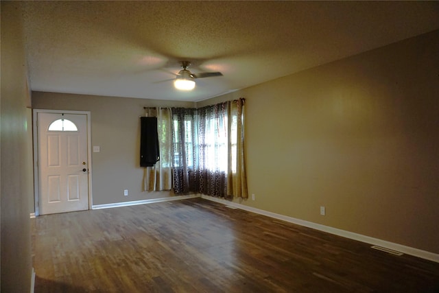 609 E Filmore St, Winterset, IA 50273 - entrance foyer featuring ceiling fan, wood finished floors, and a textured ceiling