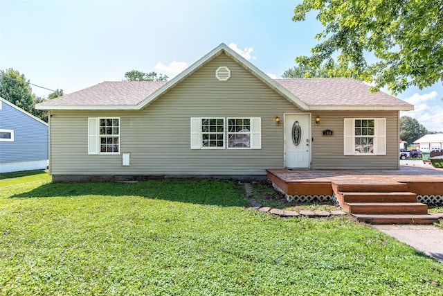 208 SW 4th St, Ogden, IA 50212 - view of front facade with a wooden deck, a front lawn, and roof with shingles