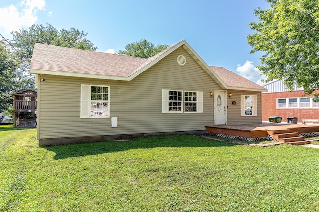 208 SW 4th St, Ogden, IA 50212 - view of front of home with a deck, a front yard, and a shingled roof