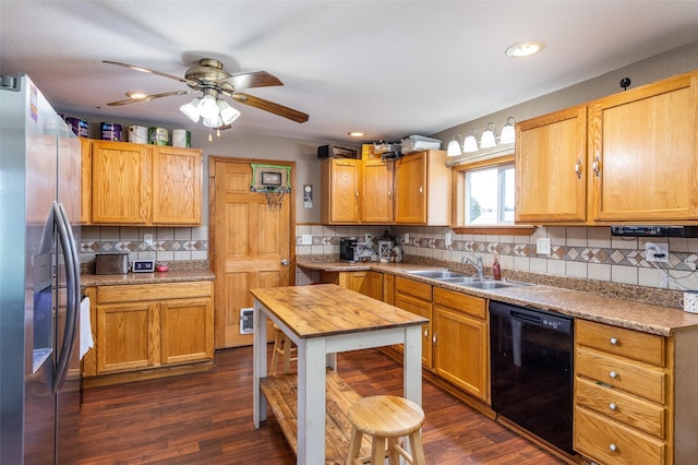 208 SW 4th St, Ogden, IA 50212 - kitchen with black dishwasher, stainless steel fridge, tasteful backsplash, dark wood-type flooring, and recessed lighting