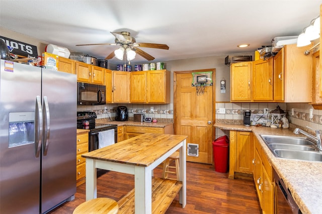 208 SW 4th St, Ogden, IA 50212 - kitchen with black appliances, light countertops, ceiling fan, tasteful backsplash, and dark wood-type flooring