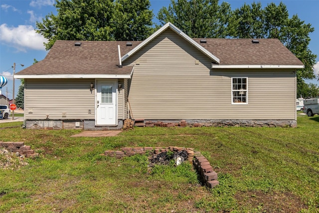 208 SW 4th St, Ogden, IA 50212 - back of property with a yard and roof with shingles
