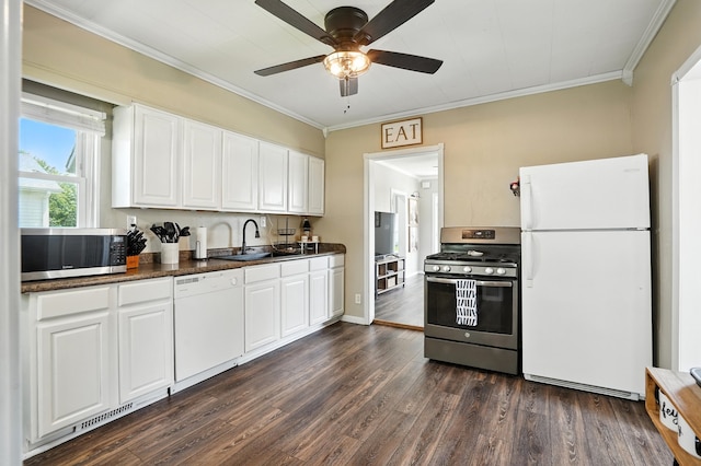 510 Maple Ave, Woodward, IA 50276 - kitchen with appliances with stainless steel finishes, dark countertops, dark wood-style floors, ornamental molding, and white cabinets