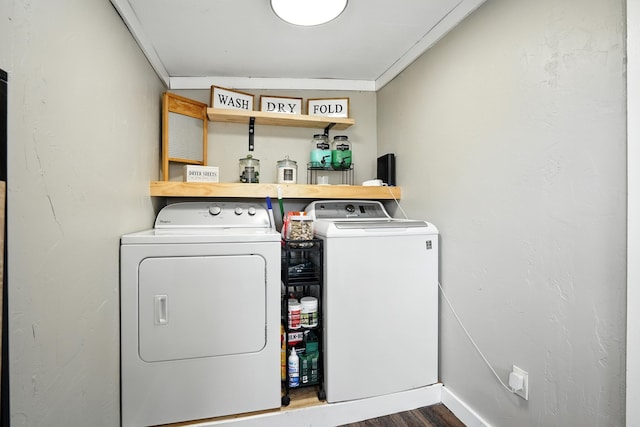 510 Maple Ave, Woodward, IA 50276 - washroom with washing machine and clothes dryer and dark wood-style flooring