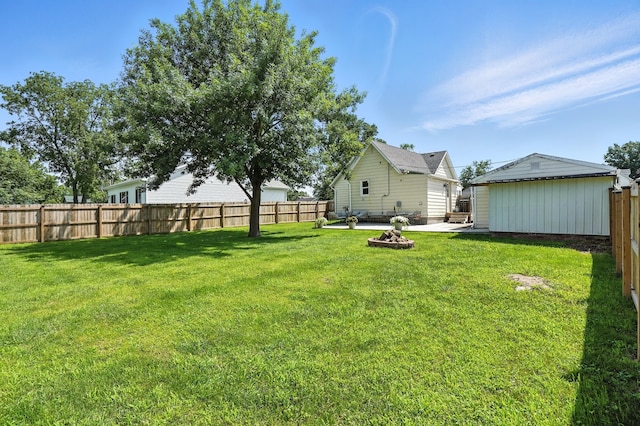 510 Maple Ave, Woodward, IA 50276 - fenced backyard with a patio area