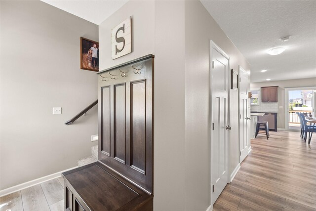 2718 NW 23rd St, Ankeny, IA 50023 - staircase with wood finished floors and baseboards