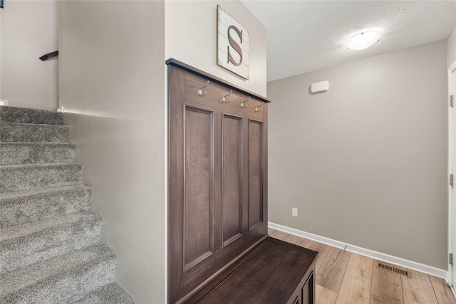 2718 NW 23rd St, Ankeny, IA 50023 - mudroom featuring wood finished floors and baseboards