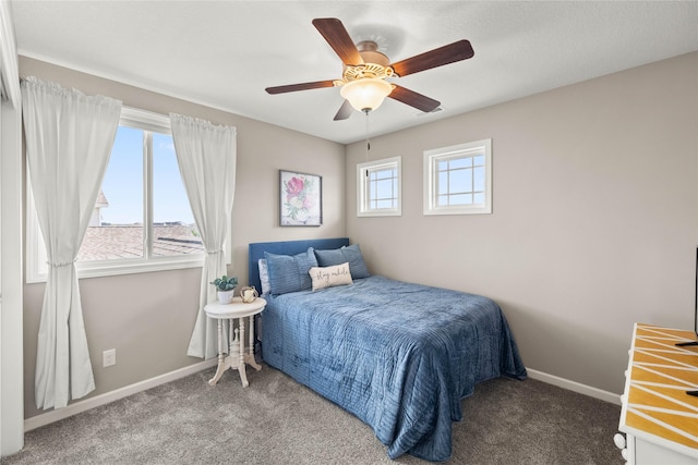 2718 NW 23rd St, Ankeny, IA 50023 - carpeted bedroom featuring baseboards and ceiling fan