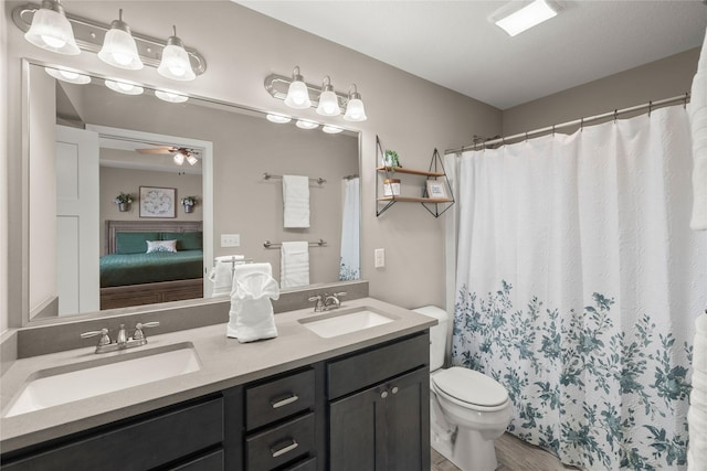2718 NW 23rd St, Ankeny, IA 50023 - ensuite bathroom with double vanity, ceiling fan, and a shower with curtain